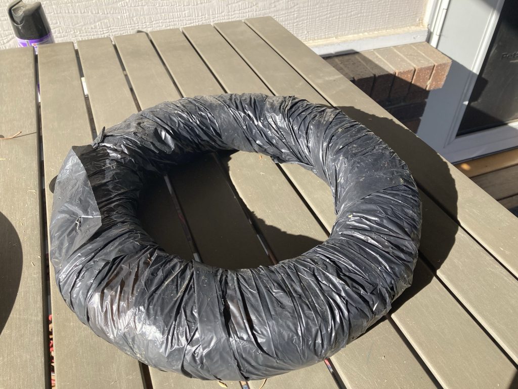 Wreath based wrapped in plastic